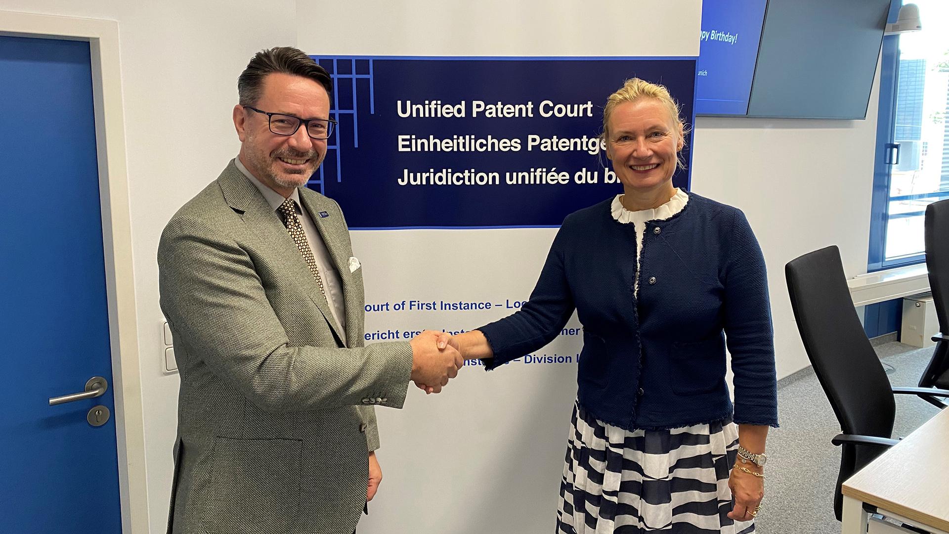 Dr Matthias Zigann, Presiding Judge of the Munich local Division of the Unified Patent Court (left) with Heli Pihlajamaa, Principal Director Patent Law and Procedures, EPO.